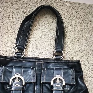 Authorities black a Coach handbag